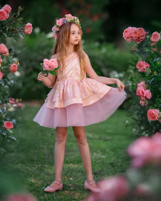 Little girl in Faeella Rosy Bloom Off - Shoulder Sequin Party Dress in garden. Perfect for birthday and holiday photoshoots, best party outfit for special occasions