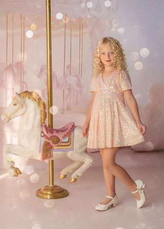 Faeella shine like a star is a Iridescent peach sequin birthday dress for girls. Perfect for flower girl and wedding event.