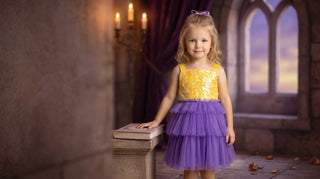 Yellow sequin and purple tulle Faeella princess dress in a storybook castle — small batch princess dress for girls