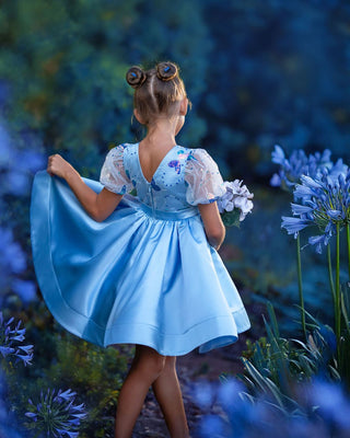 Girl wearing blue butterfly sequin, Faeella Celestial butterfly dress in magical garden, perfect for holiday party, birthday parties, wedding and flower girl.