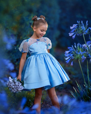 Girl wearing blue butterfly sequin, Faeella Celestial butterfly dress in magical garden, perfect for holiday party, birthday parties, wedding and flower girl.