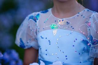 Girl wearing blue butterfly sequin, Faeella Celestial butterfly dress in magical garden, perfect for holiday party, birthday parties, wedding and flower girl.