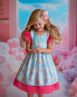 Cloud-print rainbow party dress for toddler girl. Perfect Faeella dress for everyday play.